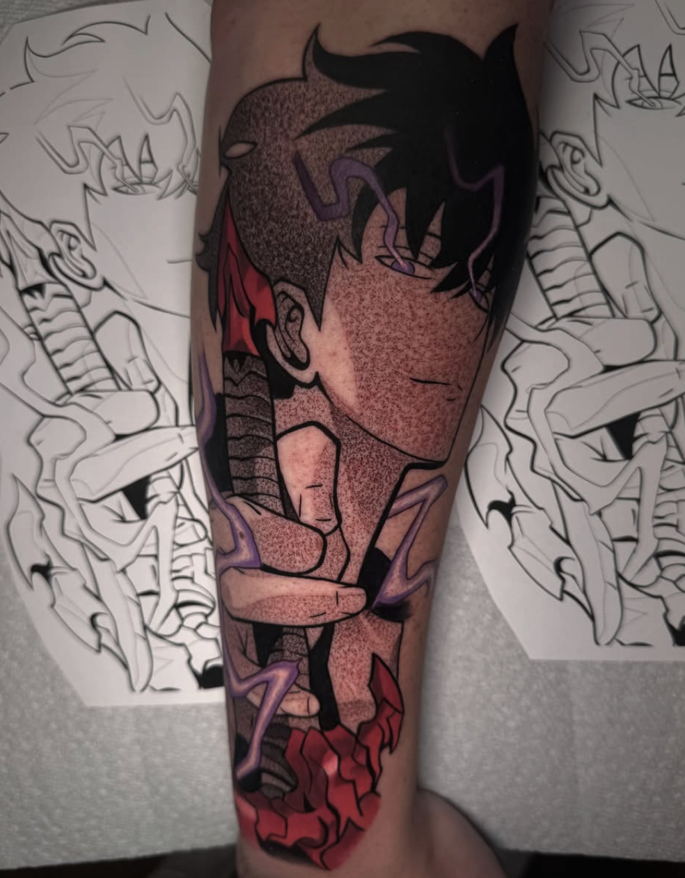 Anime character leg tattoo in black and grey with red and violet color accents